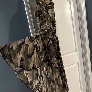 Army sheer shirt, wrap around. Long in back shorter in  front.runs like a large